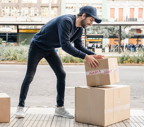 Professional movers handling boxes with care